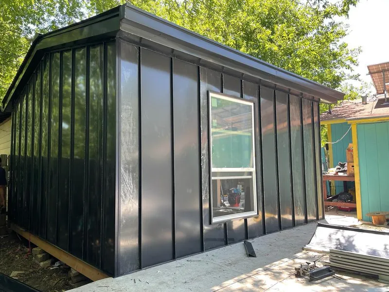 Black standing seam metal wall panels for Roof Inspection in Belen